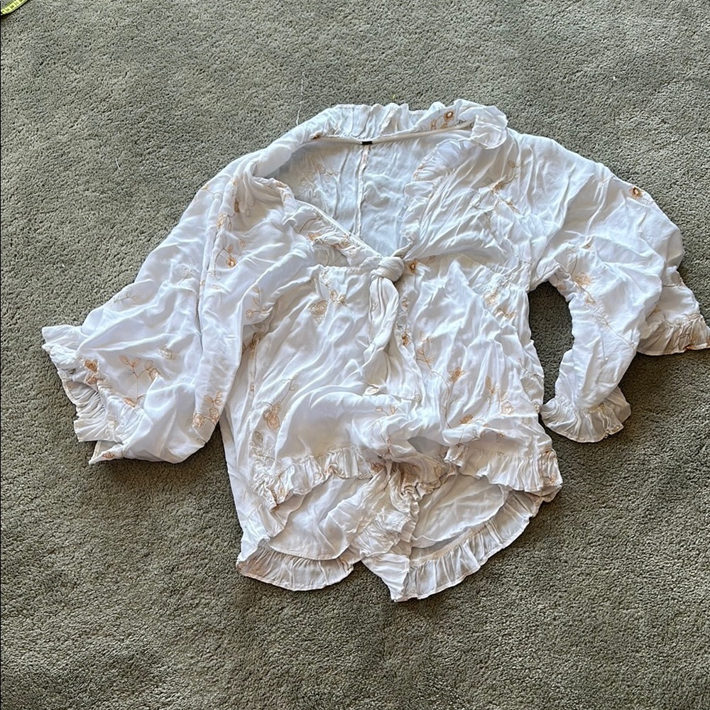 White Ruffled Free People Romper with Floral Accents